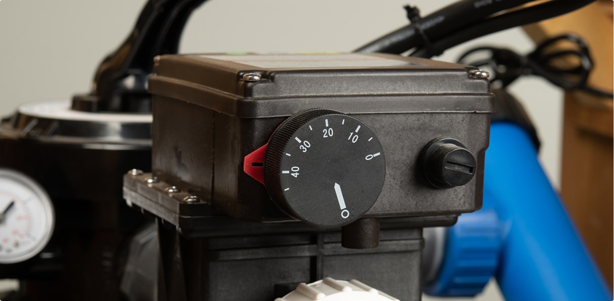 Hot tub circulation pump control unit with adjustable flow dial and temperature markings.