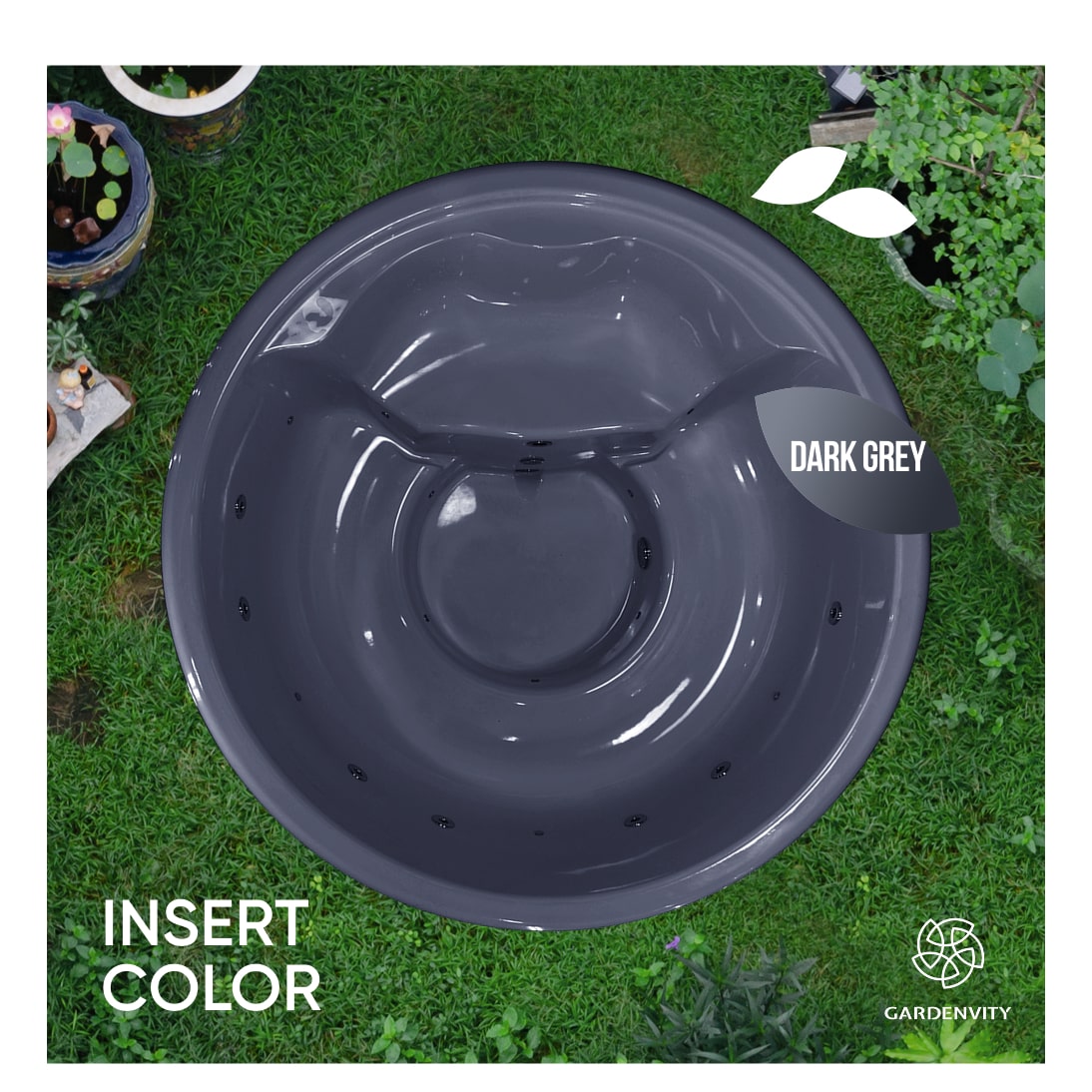Top-down view of dark grey fibreglass wood fired hot tub with jets placed outdoors on grass