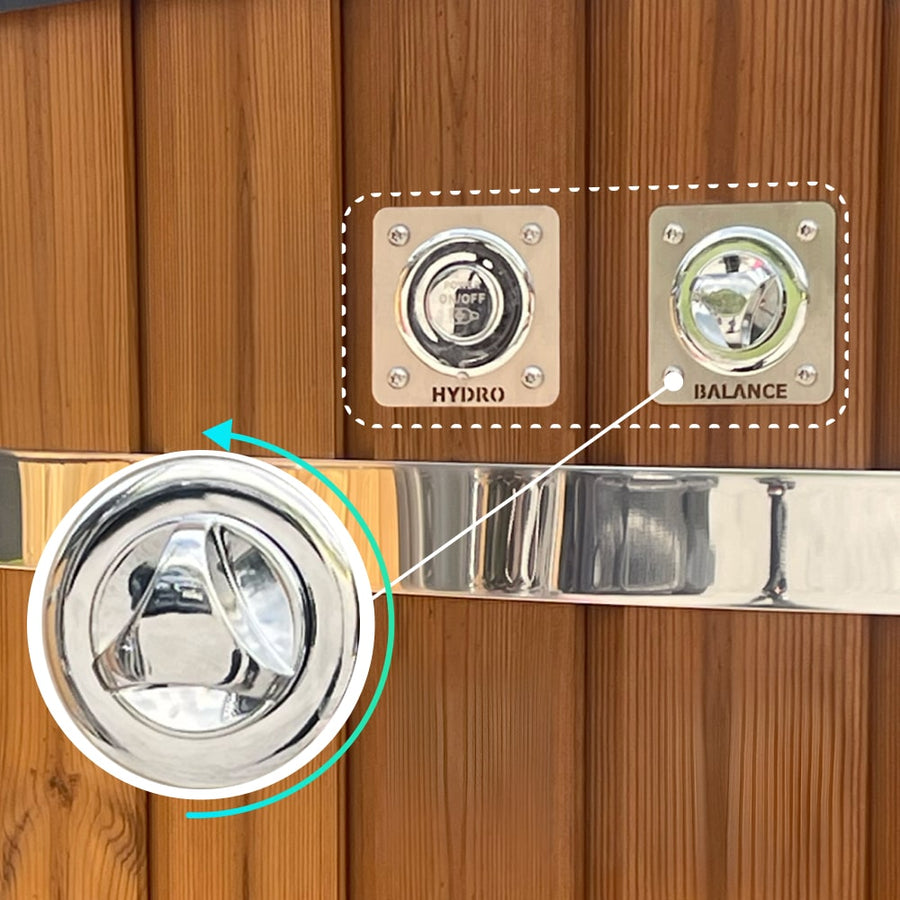 Close-up of wood fired hot tub control panel with chrome hydro switch and balance knob on wooden exterior panel